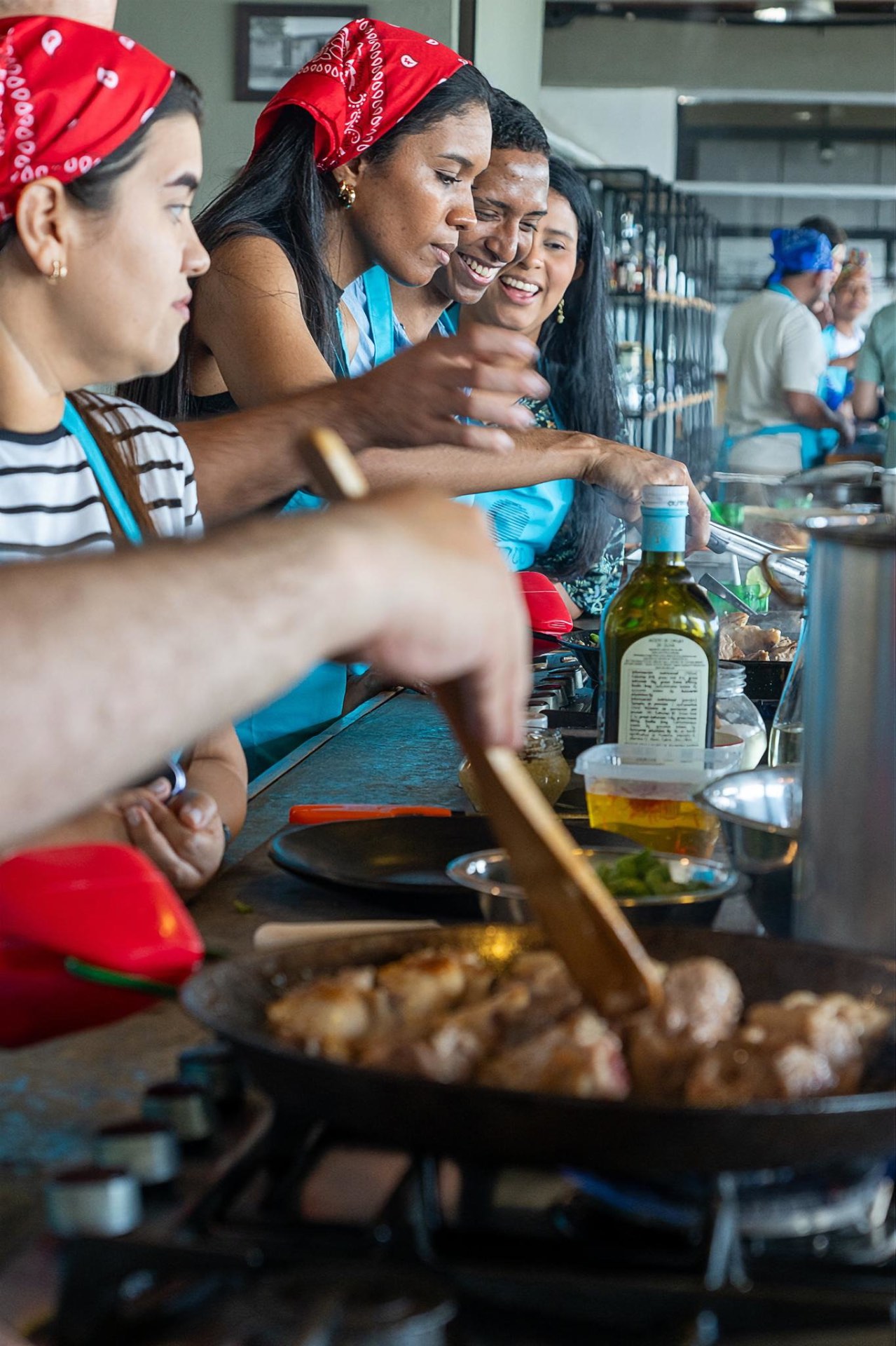 Guests cooking together during a private culinary experience in Cartagena